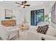Bright living area featuring light wood floors, neutral decor, and a cozy seating arrangement at 3056 Abrams Trl, Odessa, FL 33556
