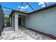 Spacious screened patio with brick floor, ceiling fan and views of the backyard at 3056 Abrams Trl, Odessa, FL 33556