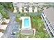 Community pool surrounded by palm trees and well-maintained landscaping, offering a relaxing retreat for residents at 3119 Oyster Bayou Way, Clearwater, FL 33759