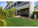 Exterior view of property including screened in patio and backyard at 3119 Oyster Bayou Way, Clearwater, FL 33759