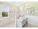 Beautiful bathroom showcasing dual vanities, framed glass walk-in shower, and decorative finishes at 3119 Oyster Bayou Way, Clearwater, FL 33759