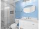 Charming bathroom featuring a glass-enclosed shower, vanity with white cabinets, and stylish fixtures at 3119 Oyster Bayou Way, Clearwater, FL 33759