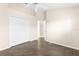 Spacious bedroom featuring wood-look floors, a large closet, and ample space for personalization at 3119 Oyster Bayou Way, Clearwater, FL 33759