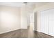Bright bedroom featuring wood-look floors, a large closet, and ample space for personalization at 3119 Oyster Bayou Way, Clearwater, FL 33759