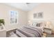 Bright bedroom with neutral tones, large window, and cozy decor for a restful retreat at 3119 Oyster Bayou Way, Clearwater, FL 33759