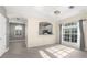 Bright dining room with hardwood floors, chandelier, and large window with nice view at 3119 Oyster Bayou Way, Clearwater, FL 33759