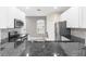 Modern kitchen featuring granite countertops, stainless steel appliances, and white cabinets at 3119 Oyster Bayou Way, Clearwater, FL 33759