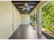 Enclosed patio providing a secluded space for outdoor lounging with serene backyard views at 3119 Oyster Bayou Way, Clearwater, FL 33759
