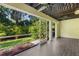 Cozy screened patio with tropical landscaping and ample room for outdoor seating and relaxation at 3119 Oyster Bayou Way, Clearwater, FL 33759
