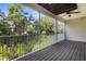 Large covered patio with view of lush landscaping, ceiling fan, and a relaxing outdoor space at 3119 Oyster Bayou Way, Clearwater, FL 33759