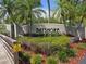 Community sign for Bayshore with lush landscaping and a boardwalk, signaling a welcoming and well-maintained neighborhood at 3119 Oyster Bayou Way, Clearwater, FL 33759