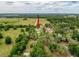 Aerial view of the property and surrounding area showing the landscape and adjacent homes at 31726 Sylvian Ln, Dade City, FL 33525