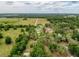 Aerial view of the property and surrounding area showing the landscape and adjacent homes at 31726 Sylvian Ln, Dade City, FL 33525
