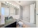Bathroom featuring granite countertop, glass vessel sink, tub, and tile surround at 31726 Sylvian Ln, Dade City, FL 33525