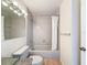 Bathroom featuring granite countertop, glass vessel sink, tub, and tile surround at 31726 Sylvian Ln, Dade City, FL 33525
