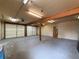 Spacious interior of the garage with double doors, providing plenty of room for parking or projects at 31726 Sylvian Ln, Dade City, FL 33525