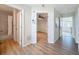 Hallway showcasing a bathroom, bedroom, and entry to the home at 31726 Sylvian Ln, Dade City, FL 33525