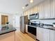 The kitchen is equipped with granite counters and stainless steel appliances at 31726 Sylvian Ln, Dade City, FL 33525