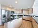 Kitchen with granite countertops, stainless steel appliances, and light wood cabinetry at 31726 Sylvian Ln, Dade City, FL 33525