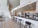 Open kitchen features a breakfast bar, granite countertops, and stainless steel appliances at 31726 Sylvian Ln, Dade City, FL 33525
