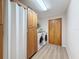 Bright laundry room featuring a washer, dryer, and storage at 31726 Sylvian Ln, Dade City, FL 33525