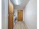 Bright laundry room featuring a washer, dryer, and storage at 31726 Sylvian Ln, Dade City, FL 33525