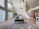 Bright living room boasts soaring ceilings, large windows, and modern decor at 31726 Sylvian Ln, Dade City, FL 33525
