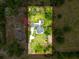 Aerial view of a beautiful home sitting on a well-maintained lot with a pool at 31726 Sylvian Ln, Dade City, FL 33525