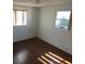 This simple bedroom boasts hardwood floors and natural light at 3214 Pinon Dr, Holiday, FL 34691
