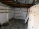 Spacious garage with open ceiling beams and plenty of room for storage and vehicle parking at 3214 Pinon Dr, Holiday, FL 34691