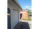 A view of the garage door on a sunny day at 3214 Pinon Dr, Holiday, FL 34691