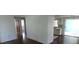 Open interior view of the living room, kitchen, and entryway at 3214 Pinon Dr, Holiday, FL 34691