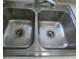 Close up view of a double basin stainless steel kitchen sink at 3214 Pinon Dr, Holiday, FL 34691