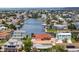 Aerial view showing the waterfront home with boat dock, set within a network of canals and residential area at 3361 Gulfview Dr, Hernando Beach, FL 34607