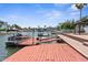 Waterfront property featuring a private dock with a boat, and offering direct access to the scenic waterways at 3361 Gulfview Dr, Hernando Beach, FL 34607