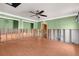 Living room needing remodel with green walls, new tile floors and great space at 3361 Gulfview Dr, Hernando Beach, FL 34607