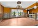 Renovated living room featuring large windows, updated flooring and view of the front yard at 3361 Gulfview Dr, Hernando Beach, FL 34607