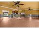 Large living room featuring a ceiling fan, water view, and wood cabinets at 3361 Gulfview Dr, Hernando Beach, FL 34607