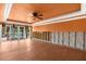 Spacious living room needing remodel with large sliding doors to the water and new tile floors at 3361 Gulfview Dr, Hernando Beach, FL 34607