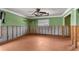 Living room needing remodel with green walls, crown molding, and tile floors at 3361 Gulfview Dr, Hernando Beach, FL 34607