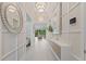 Bright entryway with stylish lighting, modern decor, and access to the living areas at 3511 Malta Ave, Wesley Chapel, FL 33543
