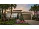 Beautiful single-Gathering home with lush landscaping, brick driveway, and two-car garage at 3511 Malta Ave, Wesley Chapel, FL 33543
