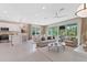 Open floor plan with a bright living room, dining area, and kitchen, offering great space and natural light at 3511 Malta Ave, Wesley Chapel, FL 33543