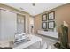 Bright home office features neutral walls, white cabinets and desk, closet, and decorative artwork at 3511 Malta Ave, Wesley Chapel, FL 33543