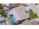Overhead shot showcasing the property's pool, landscaping, and proximity to neighboring homes at 3534 Cockatoo Dr, New Port Richey, FL 34652