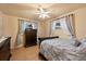 Bedroom with decorative curtains, dresser, ceiling fan, and a comfortable bed at 3534 Cockatoo Dr, New Port Richey, FL 34652