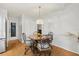 Cozy breakfast nook with a round table, decorative chairs, and an elegant pendant light fixture at 3534 Cockatoo Dr, New Port Richey, FL 34652