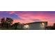 Experience the charm of this single-story home under a breathtaking sunset sky at 3534 Cockatoo Dr, New Port Richey, FL 34652