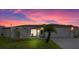 Charming single-story home with manicured lawn, beautiful landscaping, and a lovely sunset backdrop at 3534 Cockatoo Dr, New Port Richey, FL 34652