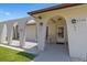 Charming arched front porch with lantern lighting offers a welcoming entrance and outdoor seating area at 3534 Cockatoo Dr, New Port Richey, FL 34652